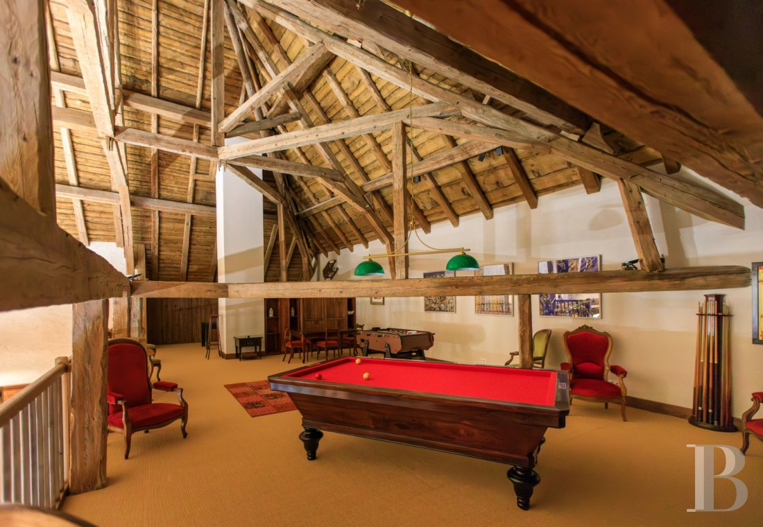 A former livestock farm which has been transformed into a vast, comfortable home near to Nantua in the Haut-Bugey region - photo  n°32
